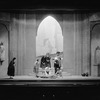 Scene from Theatre Guild's production of "Faust". Set and costumes designed by Lee Simonson. NYC: 1928. Center stage: Helen Chandler as Marguerite and Douglas Montgomery as Valentine.
