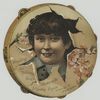 A trade card depicting a girl's face framed by a tambourine with painted flowers.