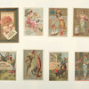[Trade cards depicting toys, women, a donkey, a mask, a kimono, a jar of meat, a parasol, a frog, shellfish and children : playing with a cat, pointing at something on the beach, holding a drawing and being lifted onto and falling off of a donkey.]