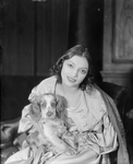 Katharine Cornell as Elizabeth Barrett and "Flush" (cocker Spaniel).