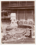 Plaster models of a Corinthian capital and four versions of tympanum relief sculpture