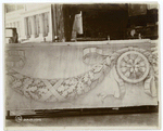 Plaster model of architectural decorations, and a model of the Fifth Avenue facade in the background