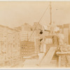 Exterior marble work : men putting a stone in place