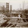 Interior work : construction of floors and bricks walls, looking west