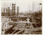 Interior work : construction of floors and bricks walls, looking west