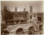 Interior work : view of workers laying bricks, from on top of the Fifth Avenue facade, looking west
