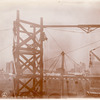 Interior work : hoisting machinery, and men pushing a marble block along  wall, looking west
