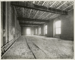 Interior work : construction of a room, showing the completed brickwork of the walls, windows and ceiling