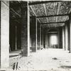 Interior work : construction of a room, showing the completed brickwork of pillars, the ceiling and a window
