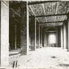 Interior work : construction of a room, showing the completed brickwork of pillars, the ceiling and a window