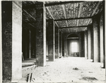 Interior work : construction of a room, showing the completed brickwork of pillars, the ceiling and a window