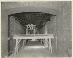 Interior work : structural framework of the ceiling of hallway, showing part of the ventilation system