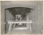 Interior work : structural framework of the ceiling of hallway, showing part of the ventilation system
