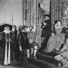Lynn Fontanne as Elizabeth the Queen, seated on throne. Set & costumes by Lee Simonson.