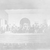 Scene from "An enemy of the people". Setting by Claude Bragdon. Walter Hampden (Dr. Stockmann), extreme left, seated. NYC: Hampden Theatre, 1927. Revival.