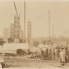 Exterior marble work : construction workers standing near the northeast corner