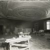 Interior work : workers assembling the fireplacee in the Trustees Room, room 245