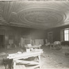 Interior work : workers assembling the fireplacee in the Trustees Room, room 245