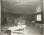 Interior work : workers assembling the fireplacee in the Trustees Room, room 245