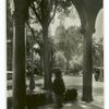 State capitol, framed by trees and an arcade, Sacramento California.
