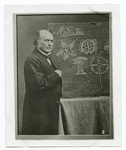 Portrait of Louis Agassiz. In this photo he is seen demonstrating his theory of jelly-fish, corals and starfish.