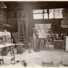 Plaster workshop : men working on models, including a Corinthian capital