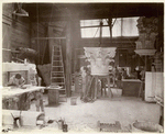 Plaster workshop : men working on models, including a Corinthian capital