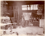 Plaster workshop : men working on models, including a Corinthian capital