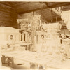 Plaster workshop : men working on a model of a Corinthian capital