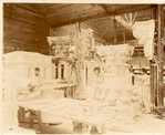 Plaster workshop : men working on a model of a Corinthian capital
