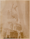 Workers hoisting a block of marble
