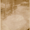 Worker attaching a marble column base to a hoisting chain