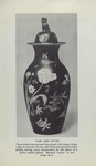 Vase and cover. (Deep cobalt ground decorated with tulips, irises, roses, in natural colours, and shells and seaweed richly gilded, having cover surmounted by the figure of a Kylin solidly gilded. Marked "SPODE" in red. H. 20 in.)