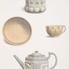 A cup and saucer, flower pot, and teapot. Jasper.