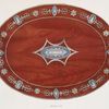 An oval rosewood box, mounted in steel. (13-5/8 x 10-3/8 at top, 3-1/4 inches deep). About 1790.