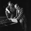 Philip Moeller (right), director, who staged "Caprice" starring the Lunts with a member of the stage crew.