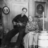 Franchot Tone as Curly McClain (with the guitar) & Helen Westley as Aunt Eller Murphy.