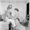 Claire Woodbury (alternating with Helen Westley) in the role of Aunt Eller, with June Walker (kneeling) in Green Grows the Lilacs.