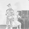 Nana Bryant (at switchboard) and Paul Everton (King Arthur)