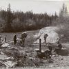 Packing on the first portage, Slave River.