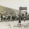 Tamping down the prairies : the track-laying machine at work on Saskatoon-Calgary line of CNR.