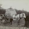 A Red River cart and driver.