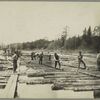 Bottom markers at work putting on boom poles, Douglas' Boom, St. John River.