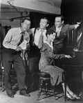 Rehearsal photo for Fine and Dandy, 1930. L to R: Joe Cook, Dave Chasen, Paul James (lyricist) with Kay Swift, composer, at piano.