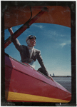 Color photo of Margaret Sullavan on plane for flying lesson