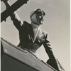 Black and white photo of Margaret Sullavan on plane for flying lesson