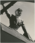 Black and white photo of Margaret Sullavan on plane for flying lesson