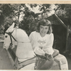 Margaret Sullavan with antique carousel horse