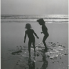 Bridget Hayward and Brooke Hayward playing on the beach