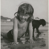 Brooke Hayward rising up from the sand on the beach